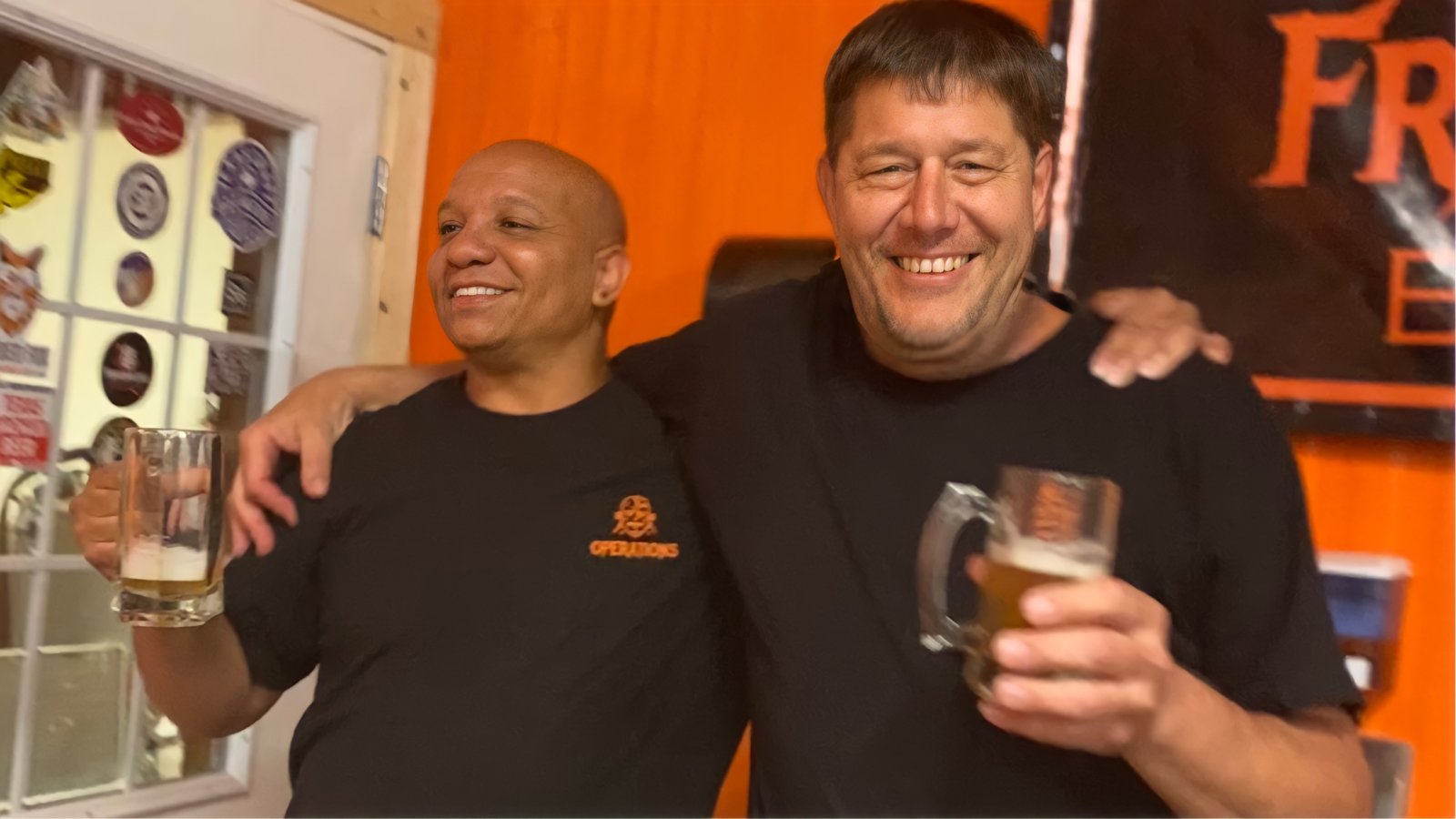 Friends sharing a beer at the brewery